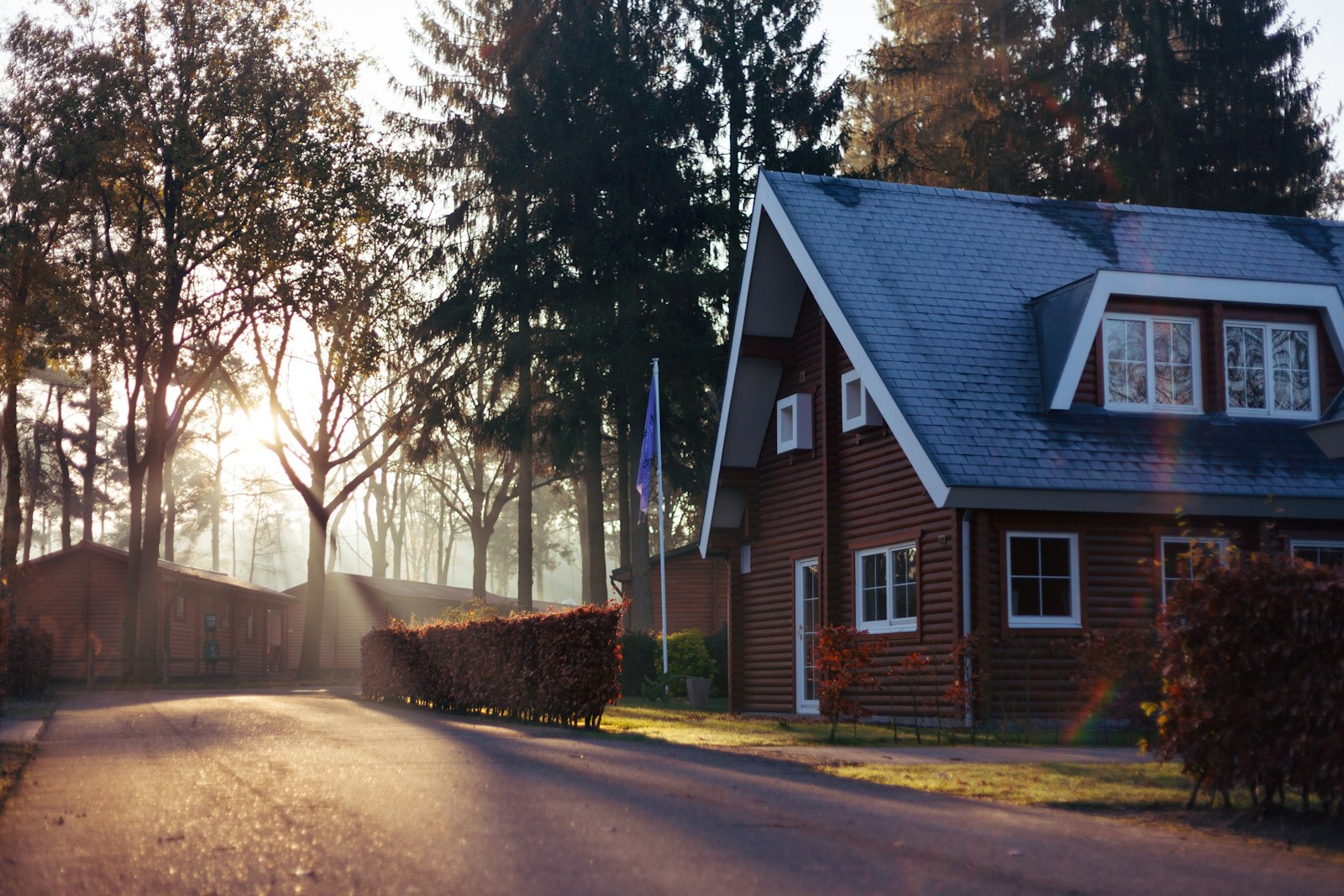 brown and red house near trees, homeowners insurance